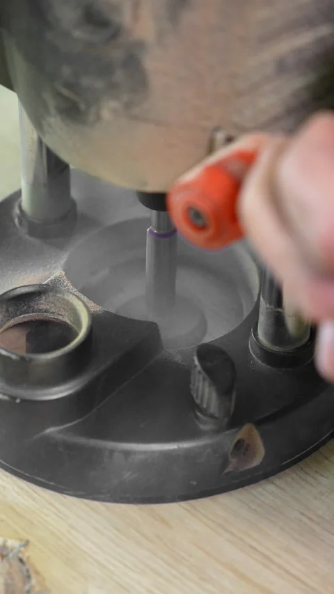 The craftsman makes a hole in the panel with a manual milling machine. Stock Footage 317414752