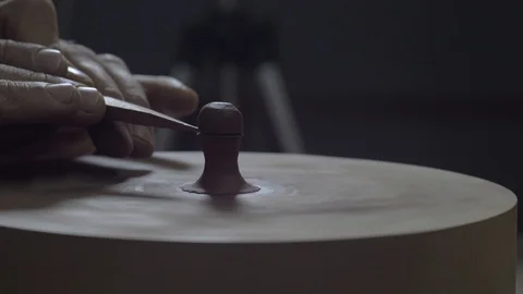 Craftsman makes lid handle for clay teapot from yixing clay. . 4k video Stock Footage 119537530