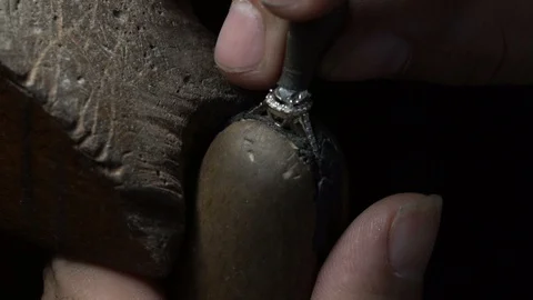 Craftsman making diamond ring. hand made jewelery. Put diamond gem ring. Stock Footage 118695759