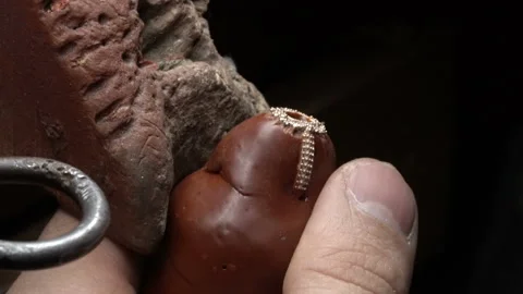 Craftsman making jewelery in his workshop. diamond jewelery product Stock Footage 139727459