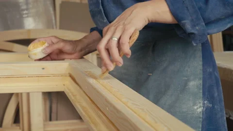 A Craftsman is manually applying the putty with the instrument in the workshop Video stock 164913125