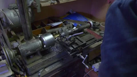 A craftsman operating a lathe machine in a workshop, focusing on precise me.. Stock Footage 282978651