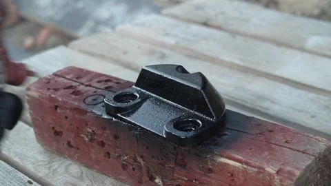 Craftsman paints a metal structure using a spray gun Stock Footage 261282231