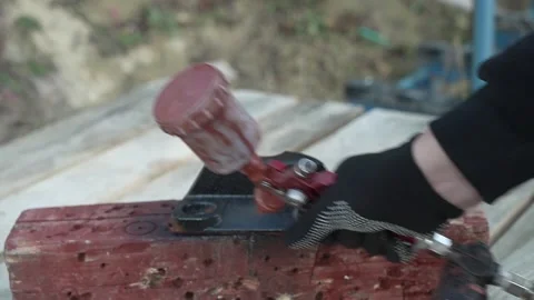 Craftsman paints a metal structure using a spray gun Stock Footage 261282254