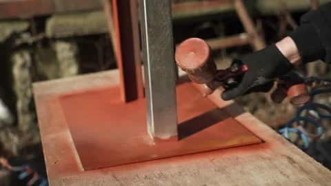 Craftsman paints a metal structure using a spray gun Stock Footage 266806172