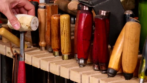 Craftsman Placing Rubber Mallet Back on Tool Shelf Stock Footage 306733294