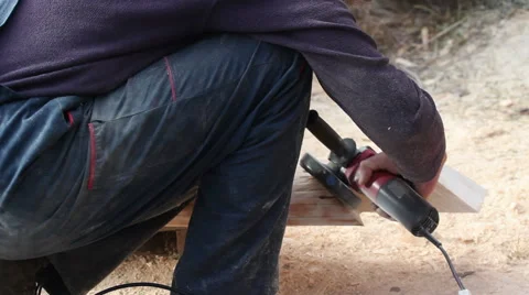 Craftsman polishing timber using electric grinder, Close-up Stock Footage 58238041