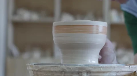 Craftsman at Pottery Master Class Potter Glazing a Rotating Pot Brush Student Stock Footage 57991314