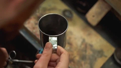 Craftsman preparing the special ammonia solution for immersion silver ring Stock-Footage 73462858