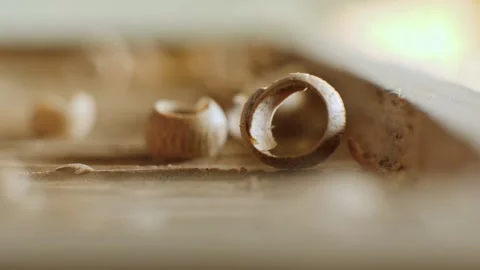 A craftsman processes a walnut board with a chisel. artisan makes a tea tray. Stock Footage 144244204