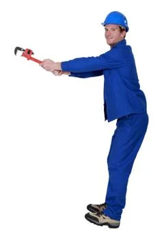 Craftsman screwing with a spanner Stock Photos