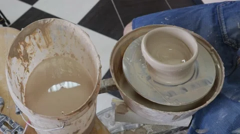 Craftsman is Separating Clay Vessel by Thread and Molding it by Hands Working Stock Footage 57994696