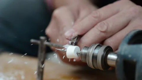 Craftsman is shaping meerschaum with machine. Stock Footage 133381892