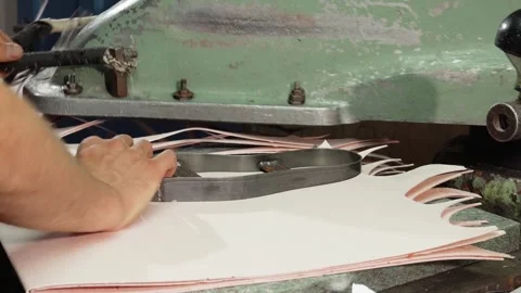 Craftsman skillfully operating an insole cutting machine in his shoe workshop Video stock 311202109