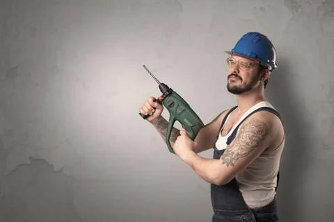 Craftsman standing in front of an empty wall. Stock-Fotos