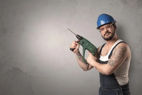 Craftsman standing in front of an empty wall. Foto stock