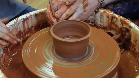 The craftsman teaches the child to make a ceramic Cup Stock Footage 97873501
