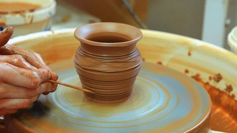 The craftsman teaches the child to make a ceramic Cup Video stock 97873886