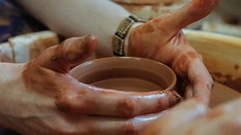 The craftsman teaches the child to make a ceramic Cup Video stock 97873898