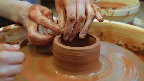 The craftsman teaches the child to make a ceramic Cup Stock Footage 97873908