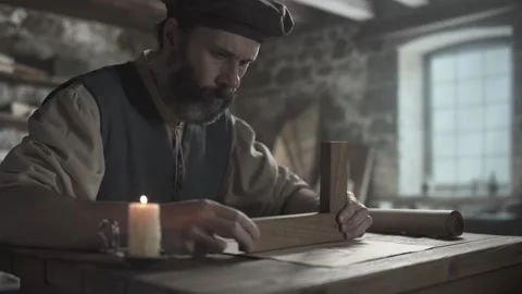 Craftsman testing wing lines on parchment paper with a wooden square 스톡 동영상 338991103