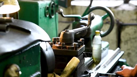 Craftsman using the obsolete lathe Stock Footage 252521618