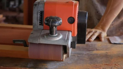 Craftsman using sander machine while carpentry work in workshop. Worker Video stock 114427586