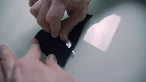 Craftsman using a sharp cutter or knife for manual leather skiving Stock Footage 152185525