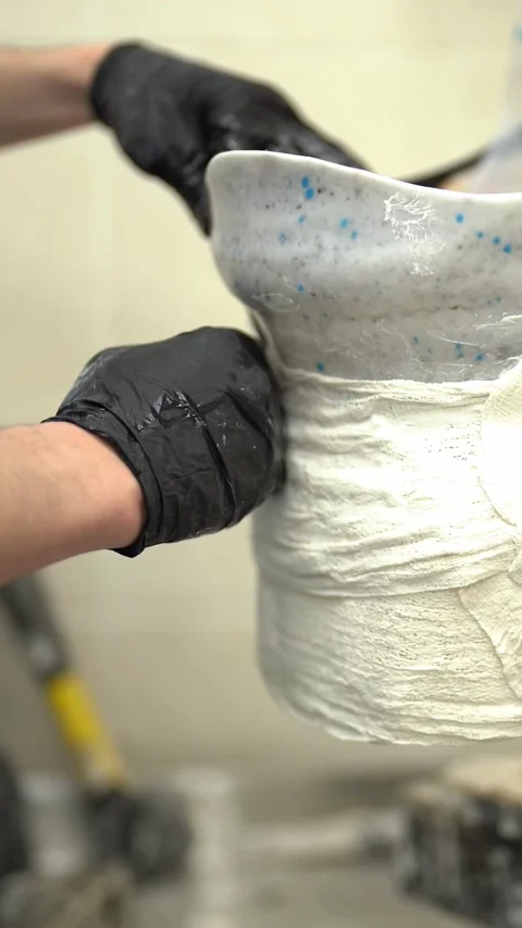 Craftsman worker manufacturing artificial limb in factory. Vertical video Stock Footage 237606557