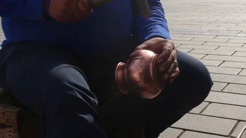 Craftsman worker is using his hammer in order to make copper jug Video stock 83520920