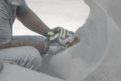 Craftsman working on classical stone statue close up Stock Photos