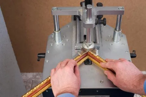 Craftsman working on frame in frameshop Stock Photos