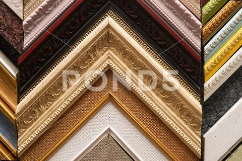 Craftsman working on frame in frameshop. Stock Photos