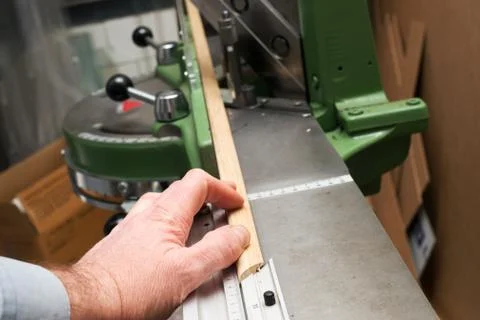 Craftsman working on frame in frameshop Stock Photos