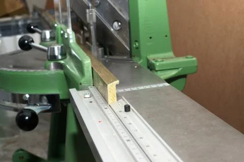 Craftsman working on frame in frameshop Stock Photos