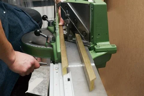 Craftsman working on frame in frameshop. Stock Photos