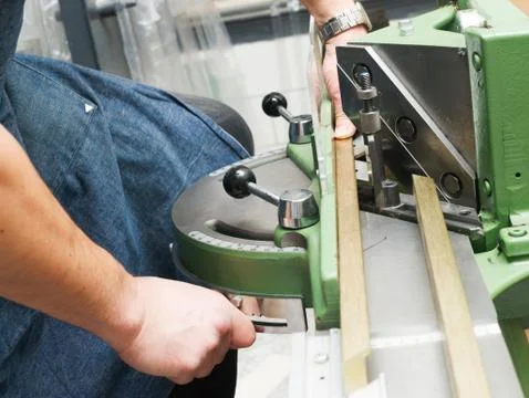 Craftsman working on frame in frameshop. Stock Photos