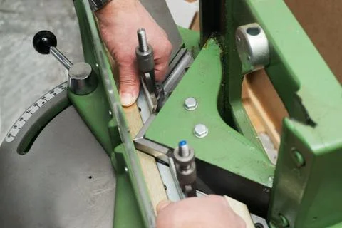 Craftsman working on frame in frameshop. Stock Photos