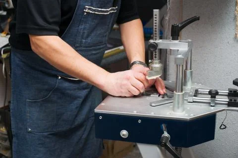 Craftsman working on frame in frameshop. Stock Photos