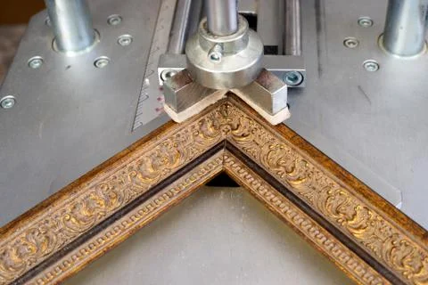 Craftsman working on frame in frameshop. Stock Photos