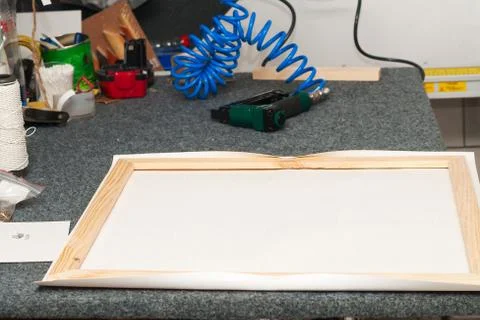 Craftsman working on frame in frameshop Stock Photos
