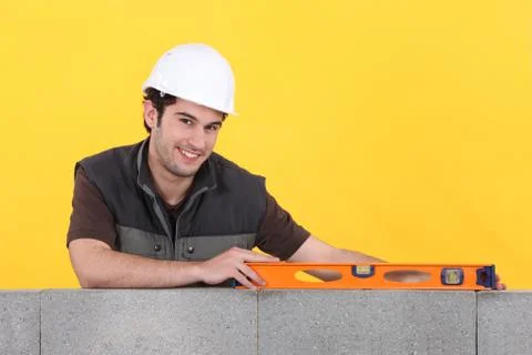 Craftsman working with a level Stock Photos