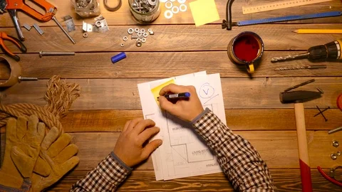 Craftsman writing word done on the note sticker, Top view. Stock Footage 70649100