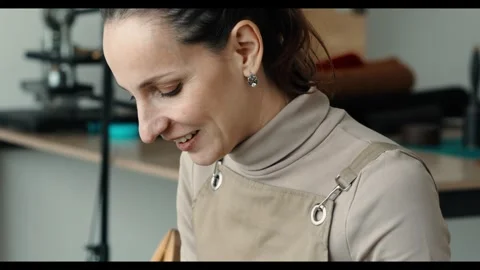 Craftsmanship, capturing the joyful moment of an artisan immersed in their work. 動画素材 297922236