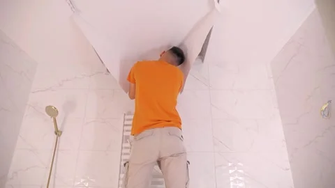 Craftsmen make a stretch ceiling Stock-Footage 277568130