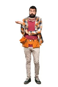Craftsmen man having doubts while raising hands Foto stock
