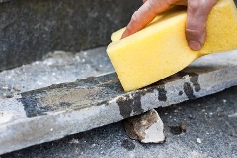 Craftsmen wets before riser with a sponge Stock Photos