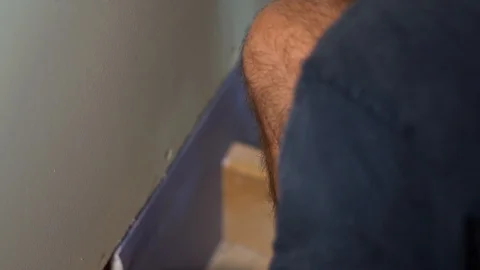 Craftsmen working with gypsum panel during a home renovation Stock Footage 94686779