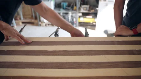 Craftsmen working in workshop with wood materials, carpenter using steel clamps Stock-Footage 163447233