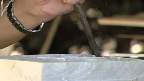Craftsperson Carving a Piece of Marble Using a Chisel and A Bone. Close Up.  Video stock 251398369